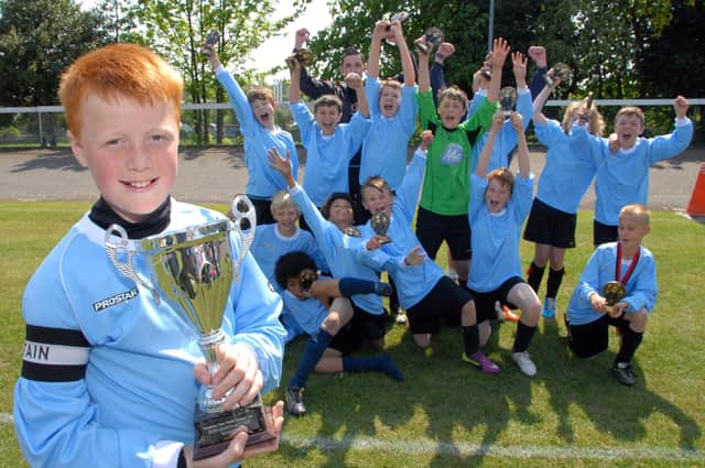 Captain Trey Foster and the Rainworth Rangers team celebrate after beating Glapwell Gladiators 2-1 in the U12 Div 2 cup final.