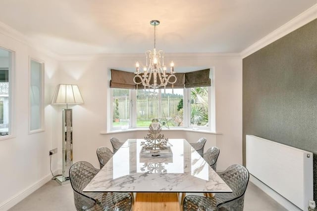 The dining room, which also features a bay-fronted window, has a touch of elegance about, don't you think?