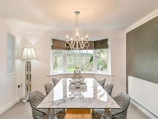 The dining room, which also features a bay-fronted window, has a touch of elegance about, don't you think?