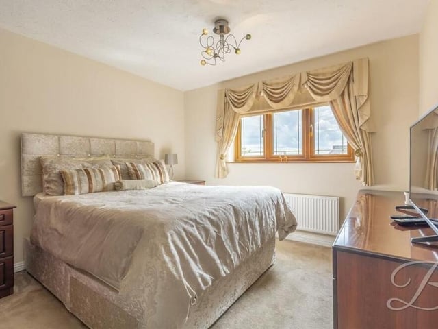 This third bedroom has a touch of elegance about it. It features fitted carpets and views of the front of the Birch Grove Gardens house.