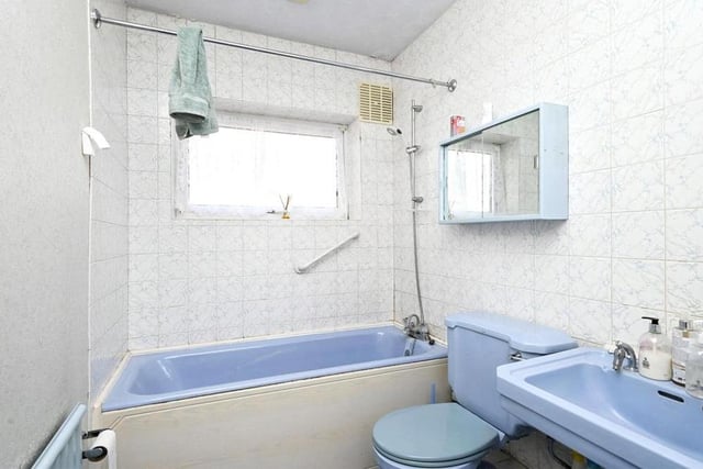 The family bathroom, which can be found towards the centre of the £190,000 bungalow, features a bath with shower over, wash hand basin and low-flush WC