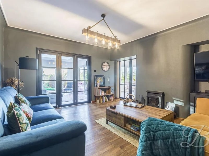 The living room is spacious, perfect for spending quality time with your family.