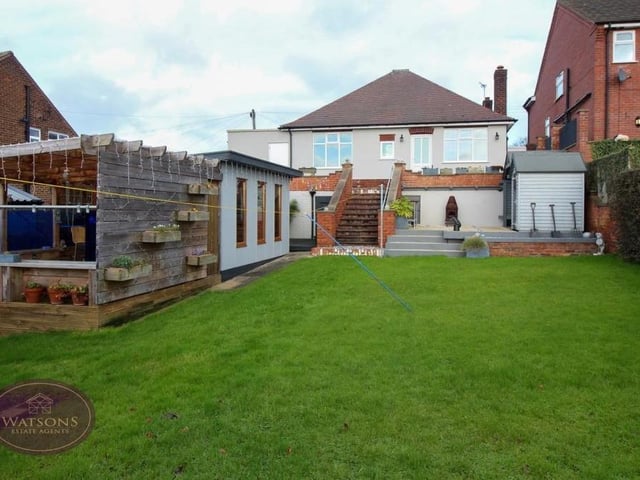 At the heart of the south-facing back garden is a well-maintained lawn. Steps lead down from the bungalow to the lawn and all the other 'attractions' in the garden.