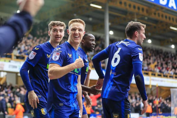 Mansfield Town remain five points clear of fourth-placed MK Dons.