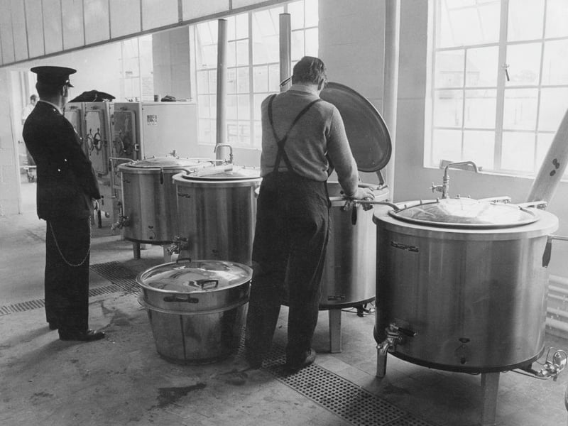 A prisoner cleans the utensils in the kitchen of Ranby Prison on12th July 1971.