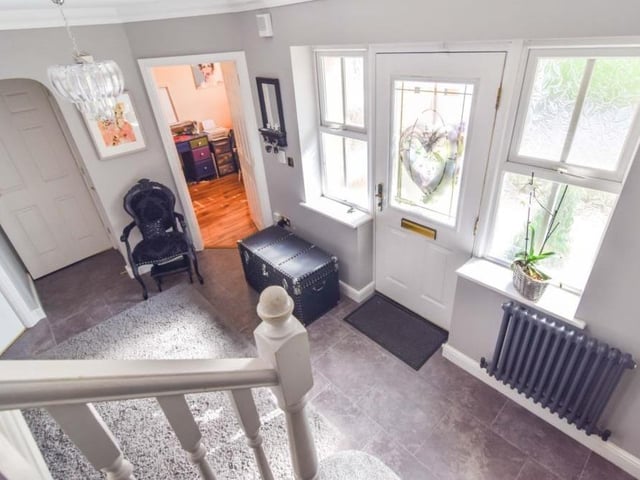 Before we move upstairs, let's take a look at the entrance hallway by the front door. Warm and welcoming.