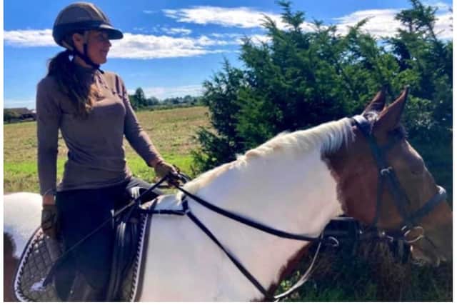Anita Marsh on her horse April in the warmer days of summer.