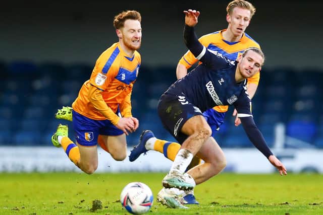 Stephen Quinn of Mansfield Town battling for possession with Kyle Taylor of Southend United last season.