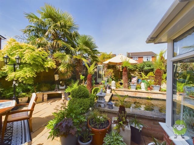 Looking more like Barbados than Mansfield, the garden is full of palm trees and other lush greenery. It is a true oasis that also features a summer house.