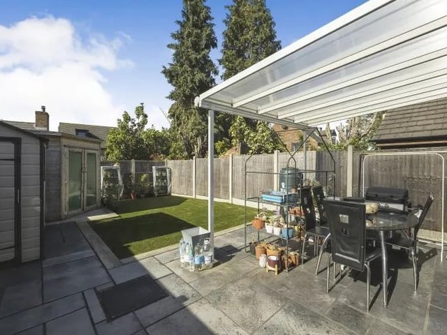The back garden also features this patio area, which is ideal for summer barbecues.