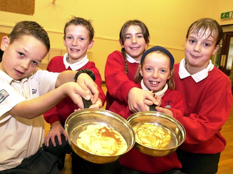 Tickhill Estfeld Primary School pupils, from left, Joe Sutcliffe, James Kilvington, Caroline Payne, Charlotte Howatson, all aged ten, and Jessica Evans, aged 11, showed off their pancake handling skills in 2003