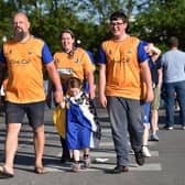 Fans arrive for a Mansfield Town game. You could join them by winning a pair of season tickets in this competition.
