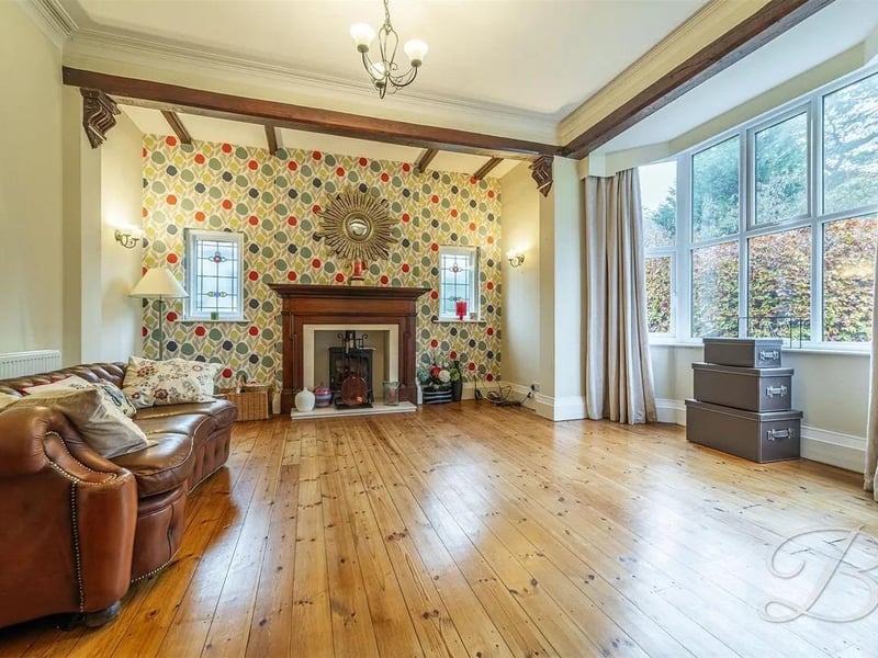 A cosy room with wooden floors and wooden beams providing a characterful space. This is the perfect space for relaxing after a long day with your loved ones.