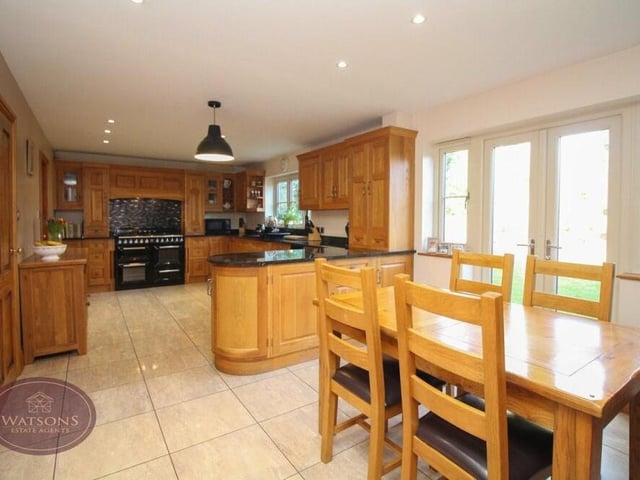 The first room we take a look at is the dining kitchen, which has a range of solid wood wall and base units. Integrated appliances include a range-style cooker with extractor over, fridge, freezer and dishwasher