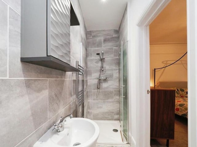 The master bedroom at the £650,000 Mansfield property has access to this compact but modern en suite shower room.