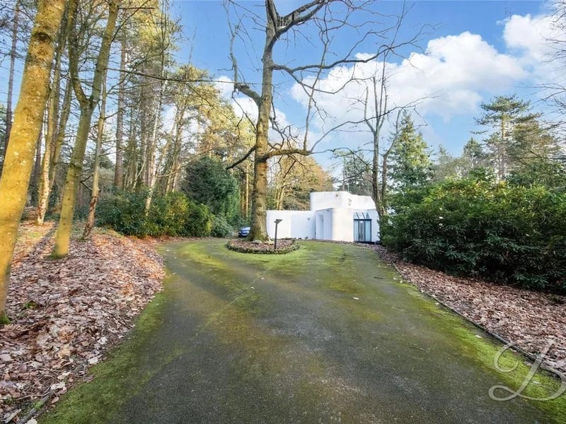 At the front of the property, gates lead to a spacious driveway offering ample parking. This magnificent outdoor space perfectly balances luxury, privacy, and convenience.