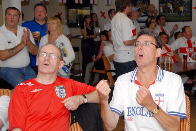Mansfield Town staff and fans watch  England's first match against USA.