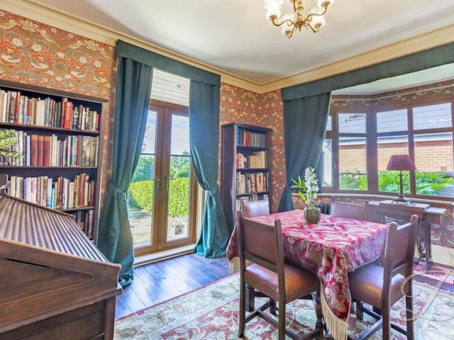 A second shot of the dining room shows patio doors that conveniently lead into the garden.
