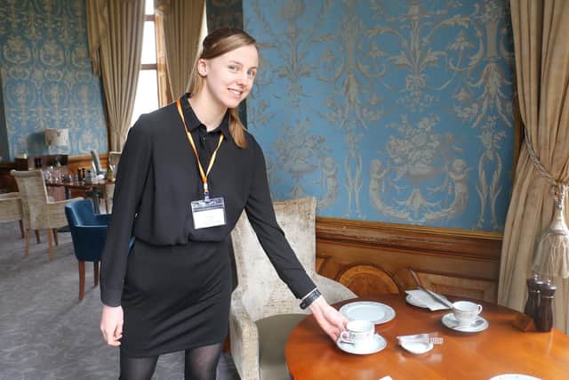 Annabelle Pye lays a table in the Brasserie 32 restaurant.