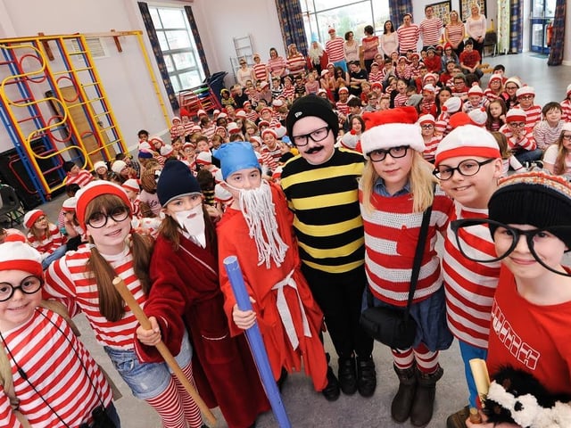 Where's Wally Day at King Edwin Primary School, Edwinstowe in 2014 for World Book Day. Pictured front l-r are prize winners, Charlie Sheppard 7, Emily Freeman 10, Emily Hubball 10, Thomas Harney 10, Oliver Goodman 11, Abigail Statham 8, Nathan Roe 9, Lucas Simpson 8.