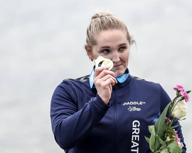 Gold medalist Charlotte Henshaw celebrates on the podium in Hungary.
