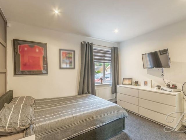 The third bedroom is a lovely relaxing retreat, complete with decorative panelling, a carpeted floor, downlights and a window to the side of the property.
