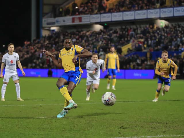 Lucas Akins' penalty is saved during the Sky Bet League 2 match against MK Dons FC at the One Call Stadium, 05 March 2024Photo credit : Chris & Jeanette Holloway / The Bigger Picture.media