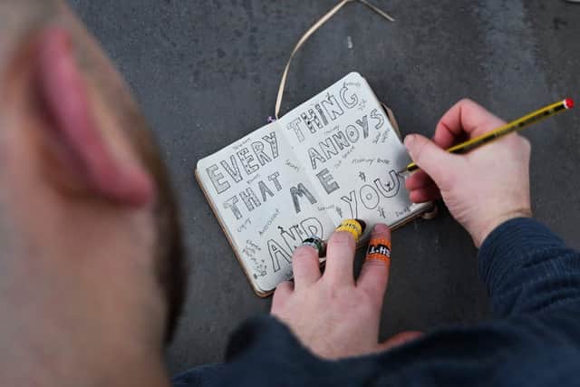 Dan Daniels draws the title of the show.