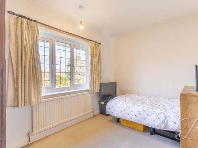 All five bedrooms have been kept to a high standard and offer excellent flexibility. This is number four, facing the back of the Forest Hill property.