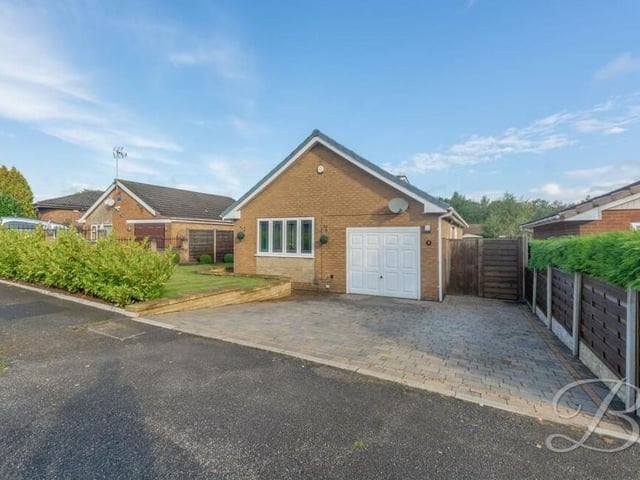 For the last photo of our gallery, we return to the front of the £325,000-plus home, where a block-paved driveway provides off-street parking space and leads to an integral garage.