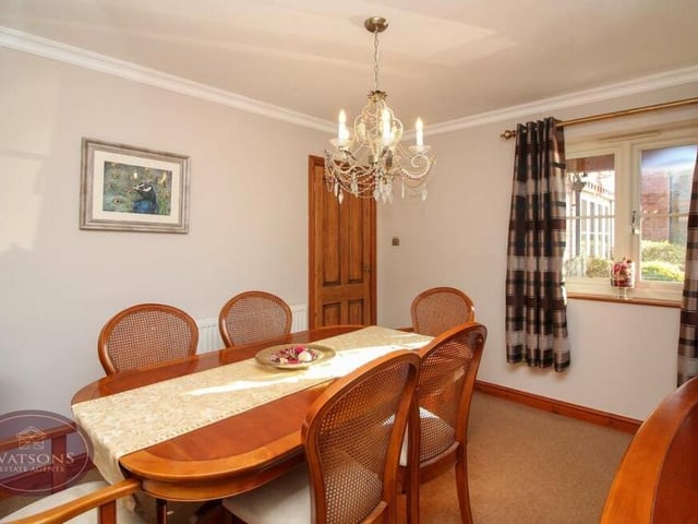 Here is the dining room at the Church Hill property. It has windows to the front and side of the house.