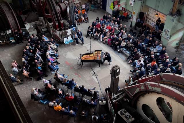 The live concert was documented in a feature-length film and will soon be released as an album, titled: 'Live at The Iron Cathedral.' Pictured - Chris performing to more than 100 people on one of the sold-out shows at the Clipstone Headstocks. Credit: Sherwood Phoenix.