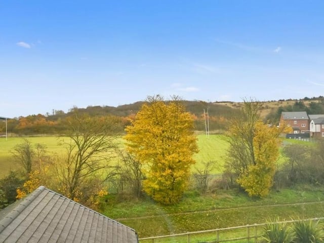 The last photo of our gallery focuses on the open playing-field views from the upstairs front of the Larwood Park house.