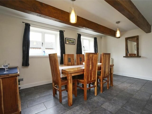From its ceiling beams to its striking floor, the dining room fits in perfectly with the rest of the unique Brinsley property.