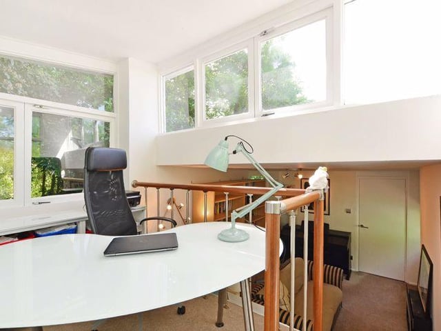 The home office is a "lovely place to work, with a peaceful garden setting".