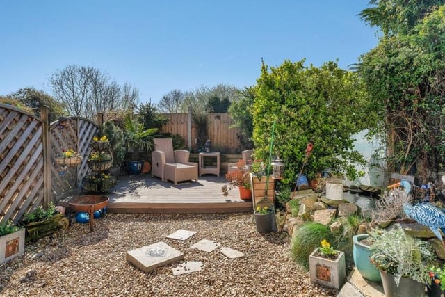 A gate at the side of the property gives access to this delightful back garden, which is private and tranquil. At the far end is a raised, decked seating area.