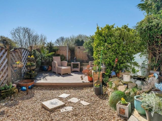 A gate at the side of the property gives access to this delightful back garden, which is private and tranquil. At the far end is a raised, decked seating area.