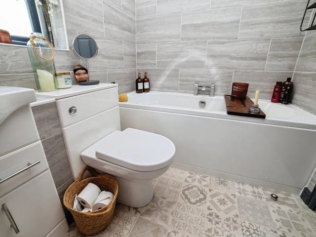 The family bathroom has high end finishes and is the perfect place to unwind after a busy day.