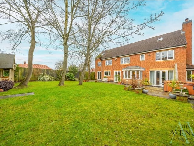 The garden is easy to maintain and features a large laid to lawn area, a patio as well as gorgeous trees, plants and shrubs.