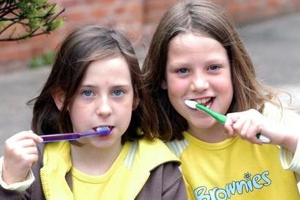 Louise Read and Clarisa Drury, members of the 1st Warsop Guides and Brownies took part in an attempt at the record for the most number of people cleaning their teeth at the same time to raise money for Childline at Warsop Parish Centre.