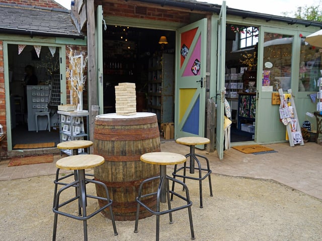 A barrel repurposed as a table for customers who want to drink outdoors.