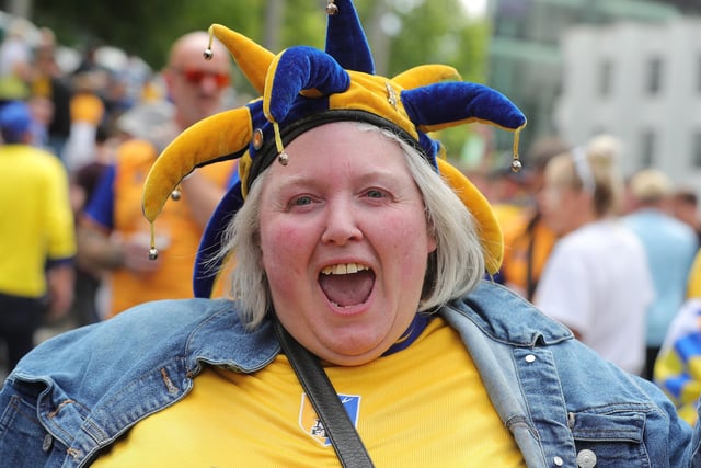 A Mansfield Town fan soaks up the atmosphere at Wembley.
