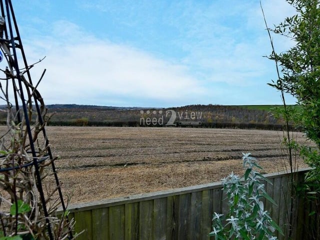 Over the garden fence, marvel at amazing countryside views such as this one.
