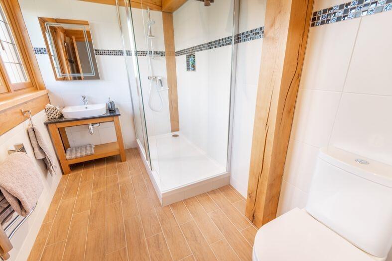 One of the attractive en suite shower rooms on the first floor, complete with enclosed shower cubicle.