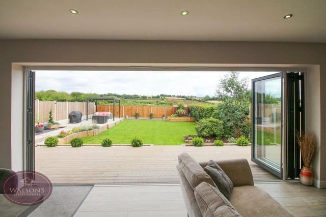 Once the bi-folding doors have been swept open, you can marvel at the view of the back garden, and the countryside beyond.