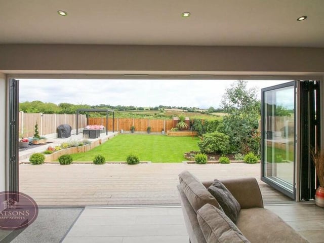 Once the bi-folding doors have been swept open, you can marvel at the view of the back garden, and the countryside beyond.