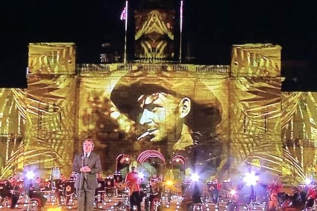 Private John George's photo was projected onto Horse Guards building.