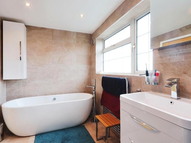 Alongside the five bedrooms on the first floor sits the family bathroom. It includes a free-standing bath, spa shower, floating vanity sink and low-level WC.