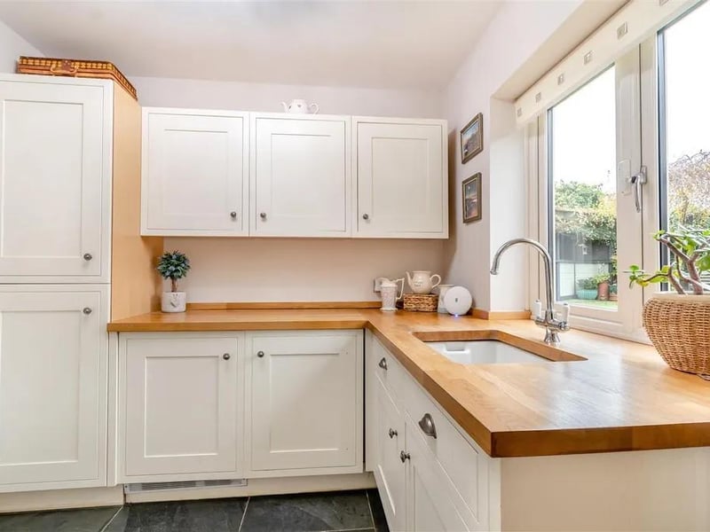 The utility features contemporary shaker cabinets comprising wall and base units with butcher's block work surfaces. Inset wash hand basin with chrome swan neck mixer tap. Tiled floor, vertical radiator, double glazed window to the rear elevation and connecting door leads to the garage