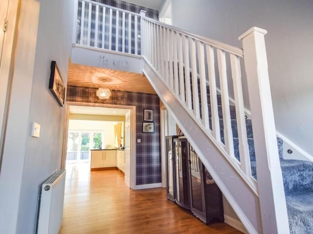 Time to step inside and, as you walk through the front door, you are greeted by this welcoming hallway.